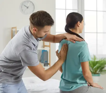 woman at physical therapy back pain treatment