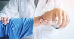 woman at elbow therapy