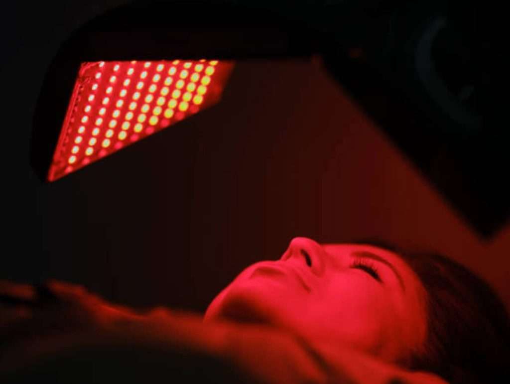 woman under red light
